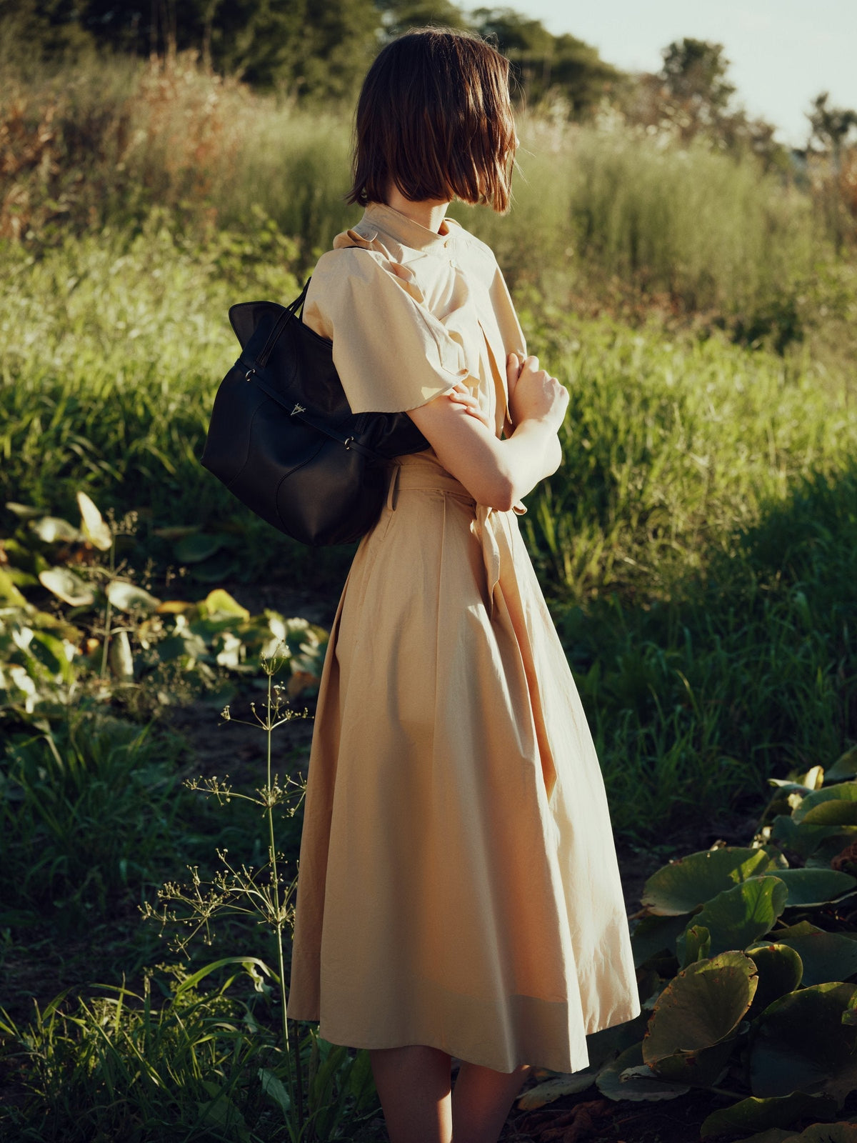 Model wearing a HiVa Atelier FW26/27 leather bag from the Ecotone collection